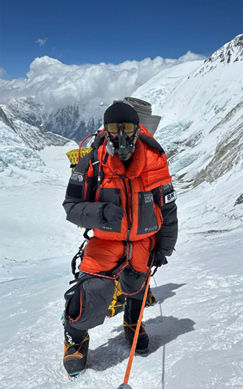 Rabindra in mountain climbing outfit on Mount Everest