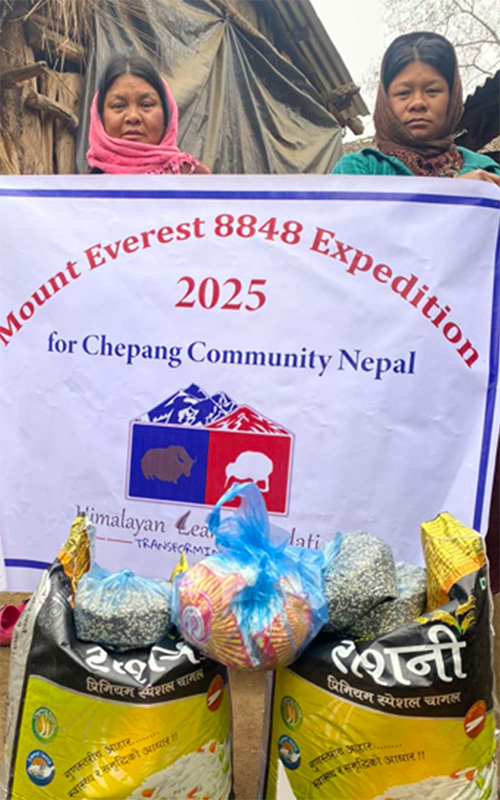 Members from the Chepang community holding up HLF Mount Everest Expedition banner